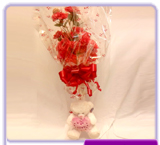 Teddy with large bouquet 